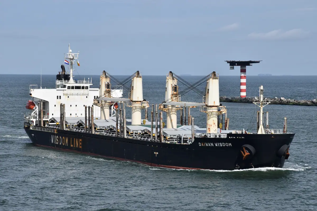 A bulk carrier under way on open water